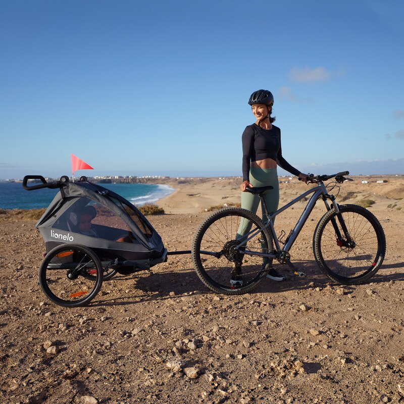 Carucior si remorca de bicicleta, Lionelo, Cama, Multifunctional, Pentru 1 sau 2 copii, Cu sistem de absorbtie a socurilor SIQ, Geamuri cu protectie solara, Negru