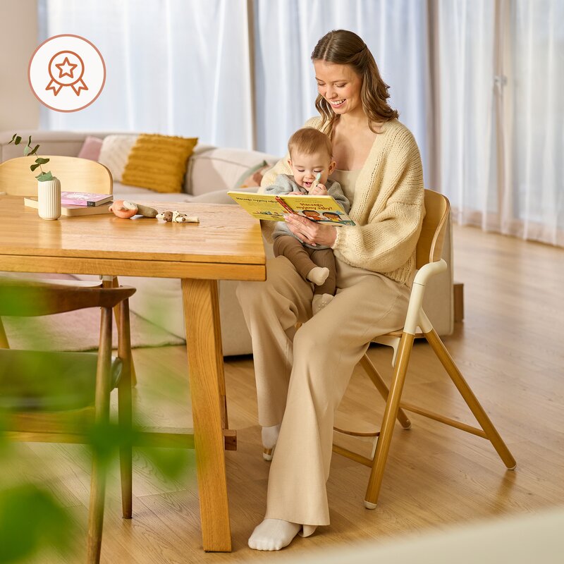 Scaun de masa multifunctional Celia, Lionelo, Din lemn de fag, 6 luni- adult, Reglabil pe inaltime, Spatar lat, Sezut ergonomic, Tavita silicon, Suport de picioare reglabil, Greutate maxima 90 Kg, Alb/Natural